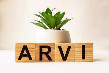 wooden cubes with text ARVI. the medicine. medical concept