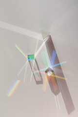 Glass geometric figures prisms with light diffraction of spectrum colors and complex reflection...