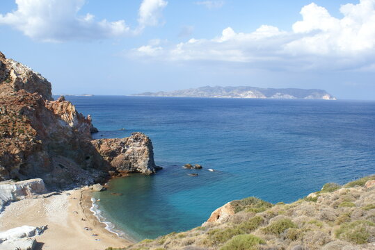 Panoramic view of Paliorema Beach in Milos, Greece. Poliegos island in the background