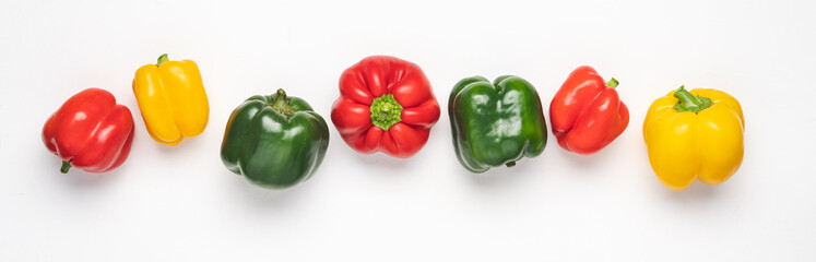 Line of colorful bell peppers on white background. Banner size