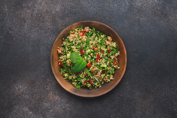 Quinoa salad with parsley, cucumber and cherry tomatoes. Tabbouleh Traditional middle eastern or arab dish
