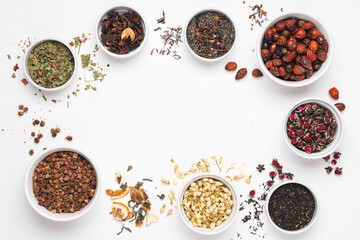 Different types of tea in bowl on white background. Rose hips, jasmine, rose flower, green, berry, hibiscus tea