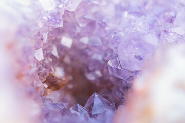 Abstract blurred background with shiny purple amethyst crystal geode , full frame with selective focus on various points