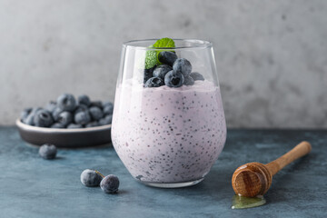 Blueberry chia pudding with fresh berries and honey. Healthy breakfast concept