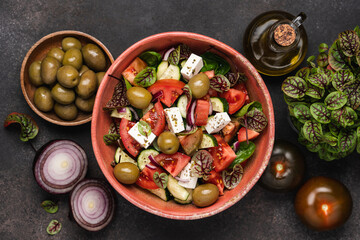 Fototapeta na wymiar Traditional Greek salad with feta cheese. Bright and juicy vegetable healthy snack