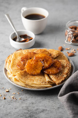 Traditional French thin pancakes crêpe suzette with orange sauce. Morning breakfast dessert
