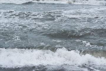 Winter seascape background, splashing water waves