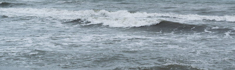 Winter seascape background, splashing water waves