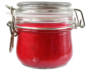 Cream honey with cherries in a glass jar