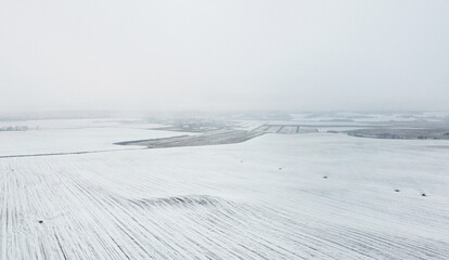 Top view of winter snow agro field