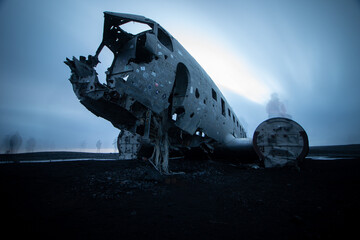 Fototapeta na wymiar Moving people at crash site - DC3 Plane Wreck, Iceland
