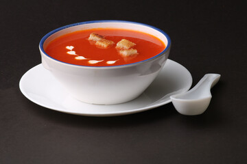 Tomato soup with croutons and fresh cream.
