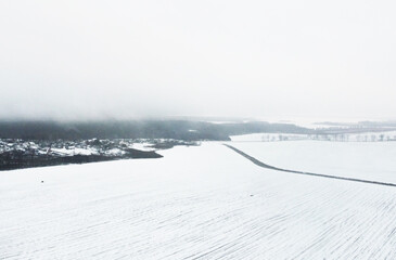 Top view of winter snow agro field