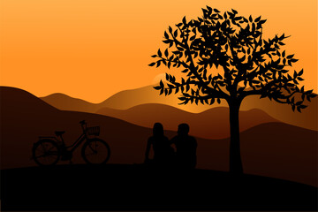 A husband and wife form a silhouette at sunset