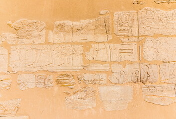 Egyptian hieroglyphs carved in stone. The Karnak Temple Complex, a vast mix of decayed temples, chapels, pylons, and other buildings in Luxor, Egypt