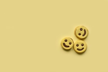 smiling butter cakes with chocolate filling on a yellow background