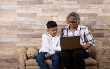 Happy moments with grandma, indian or asian senior lady spending quality time with her grand son...