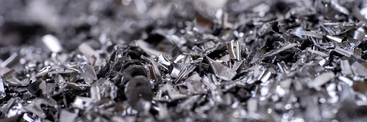Foto auf Acrylglas Metallspäne. Panoramahintergrund von metallischen Chips. Verarbeitung von Eisenmetallen in einer Fabrik © kelifamily