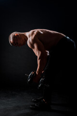 Fitness muscular body on dark background