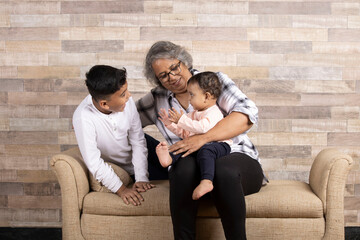 Happy moments with grandma, indian or asian senior lady spending quality time with her grand...