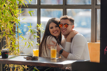Couple hugging and enjoying time together. Lovers spending quality time together on a sunny day.