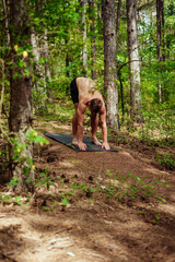 Fitness exercise. athletic active man with fit muscular body stretching, exercising before running