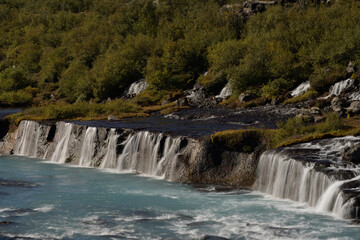 Hraunfossar waterfalls cascading into the Hvítá river over ledges of lava rock