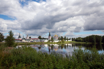 Lake Valdayskoye in the early summer morning and view of the Valdai Iversky Monastery. Valdaysky District of Novgorod Oblast, Russia. August 2020.