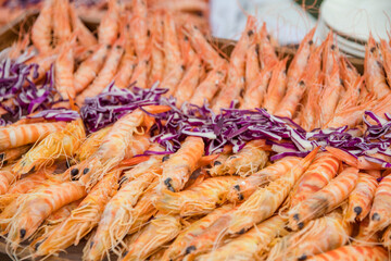 Freshly cooked shrimps ands tiger prawns on a plate.