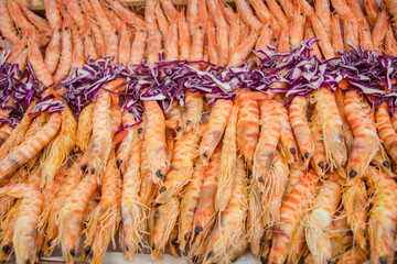 Freshly cooked shrimps ands tiger prawns on a plate.