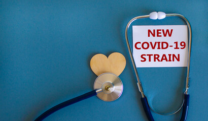 New Covid-19 strain symbol. White card, words 'new covid-19 strain' and stethoscope, blue...