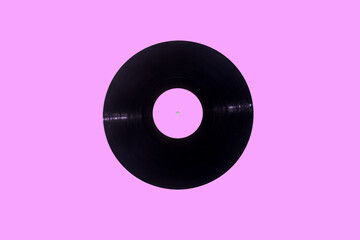 Music vinyl record on pink background with pink label. Breast cancer concept