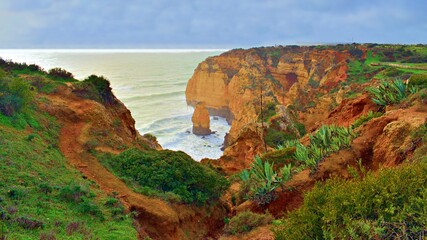 view of Ponta da Piedade, a spectacular rocky promontory along the coast of the city of Lagos in the Portuguese Algarve region. They are one of Portugal's most popular tourist attractions