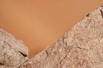 Beige natural stone on a beige background. High quality photo