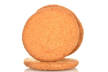 Three freshly baked round American cookies, close-up, isolated on white.