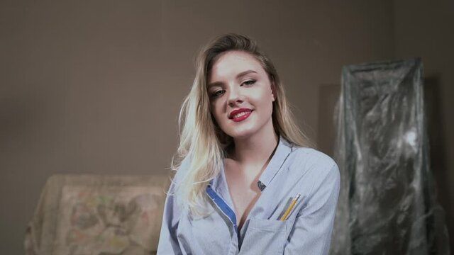 Sexy Blonde Girl Artist in Art Studio