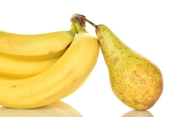 Several ripe yellow bananas and one sweet pear, close-up, isolated on white.