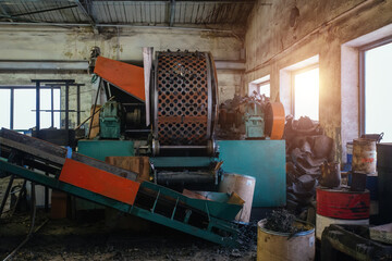 Fototapeta na wymiar Process of recycling of waste rubber parts in the factory