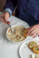 clams chowder cream soup with shrimps and potato