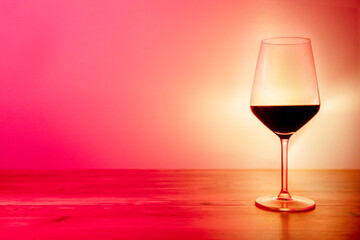 Moody and romantic glass of red wine space for copy