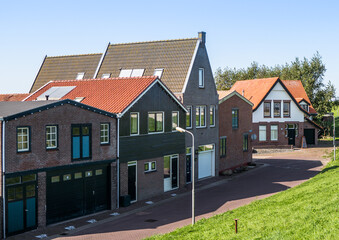Fototapeta na wymiar Dutch homes by the seaside in Den Oever, Netherlands.
