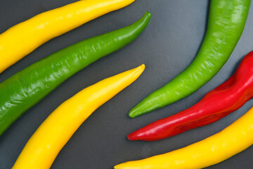 yellow, red and green hot chili on a plate. Pepper. Vegetable vitamin food.