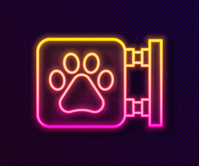 Glowing neon line Veterinary clinic symbol icon isolated on black background. Cross hospital sign. A stylized paw print dog or cat. Pet First Aid sign. Vector.