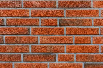 New and clean with rich colors red orange brown brick wall, clinker bricks. Brick texture