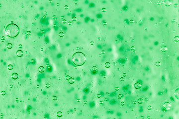 Liquid cream gel, green blue cosmetic texture with bubbles