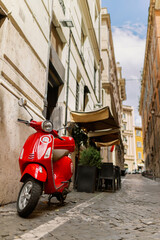 Plakat scooter parked in the Italian narrow street