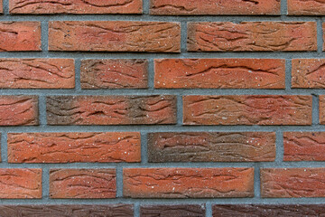 New and clean with rich colors red orange brown brick wall, clinker bricks. Brick texture