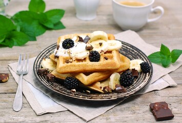 Whole grain waffles with chocolate, banana, cottage cheese, milk, coffee