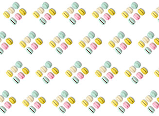 Almond cookies, in pastel colors on a white background. Traditional French multicolored dessert, close-up. pattern