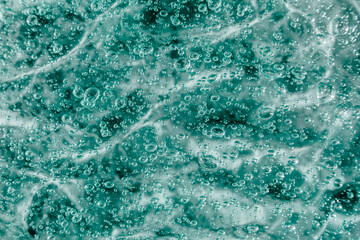 Liquid cream gel, green blue cosmetic texture with bubbles